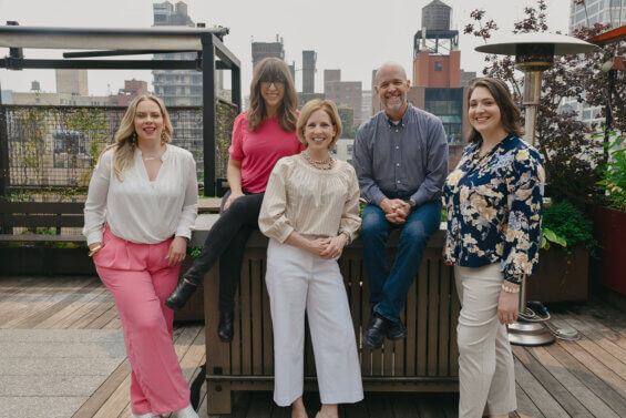DCI's partner team photographed on a New York city rooftop