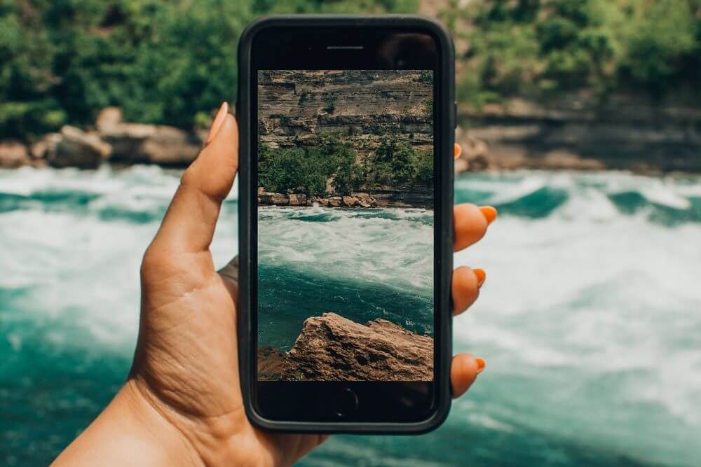 Smartphone photographing a landscape