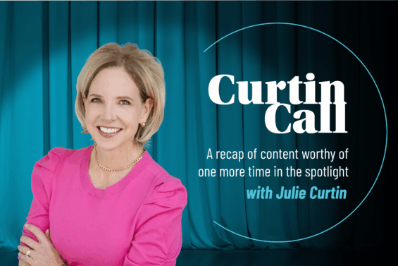 Teal curtain backdrop behind a woman in a pink shirt with large white words that read 