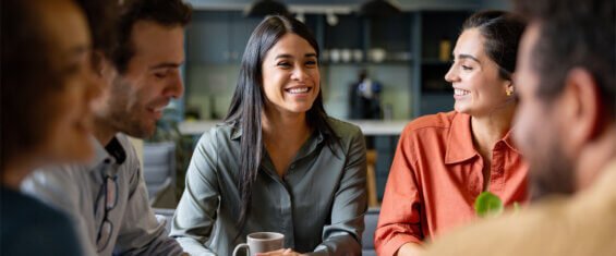 DCI talent wars front cover image, girl smiling with a group of friends in a corporate setting