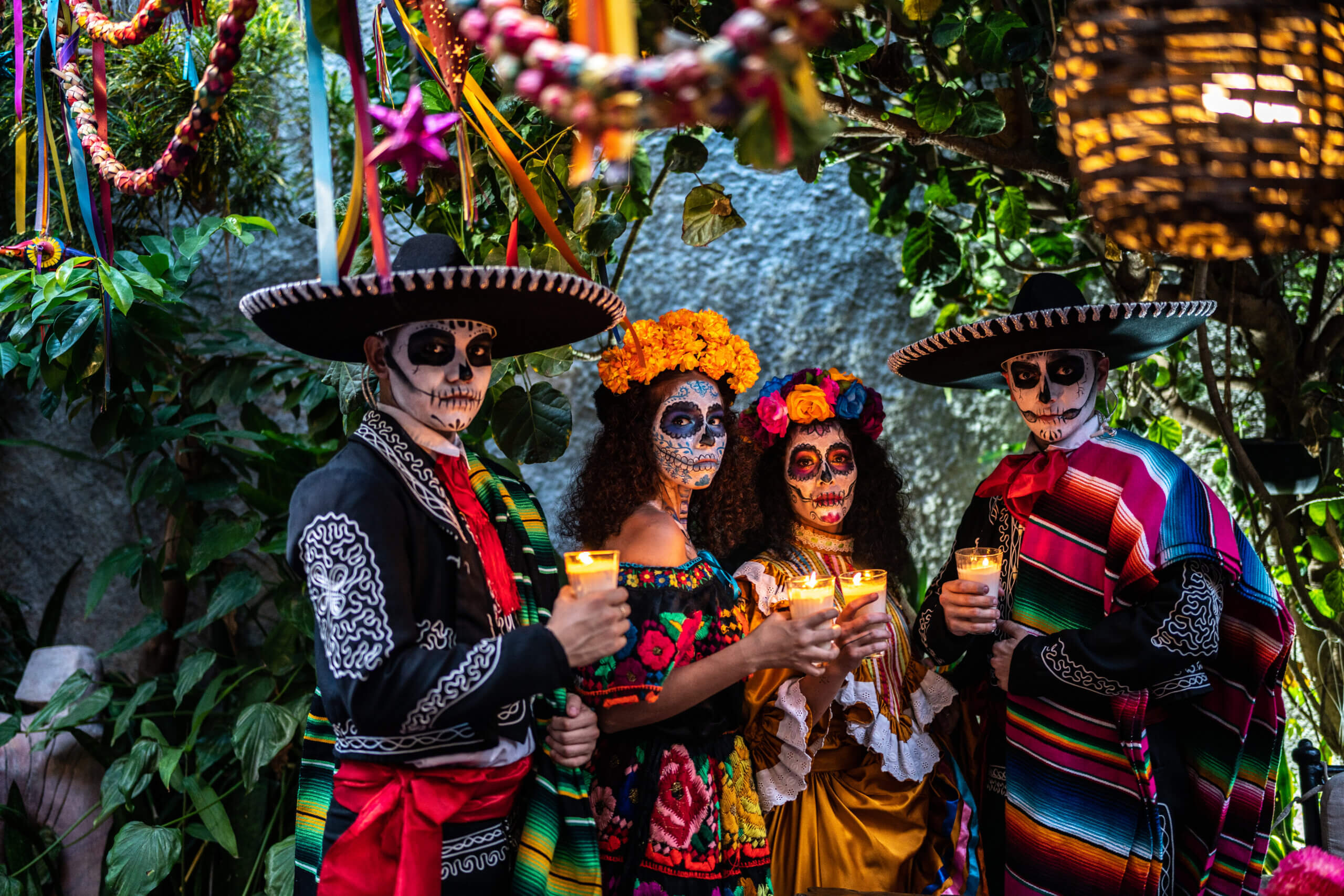 Group of four people dressed up for Day of the Dead in San Antonio