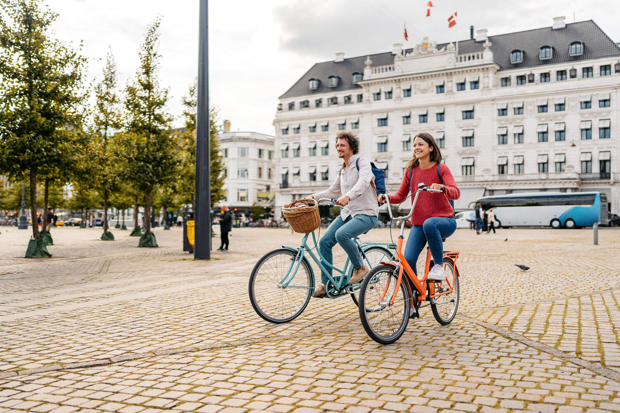 Two people riding bikes in the city developing a perception of a place