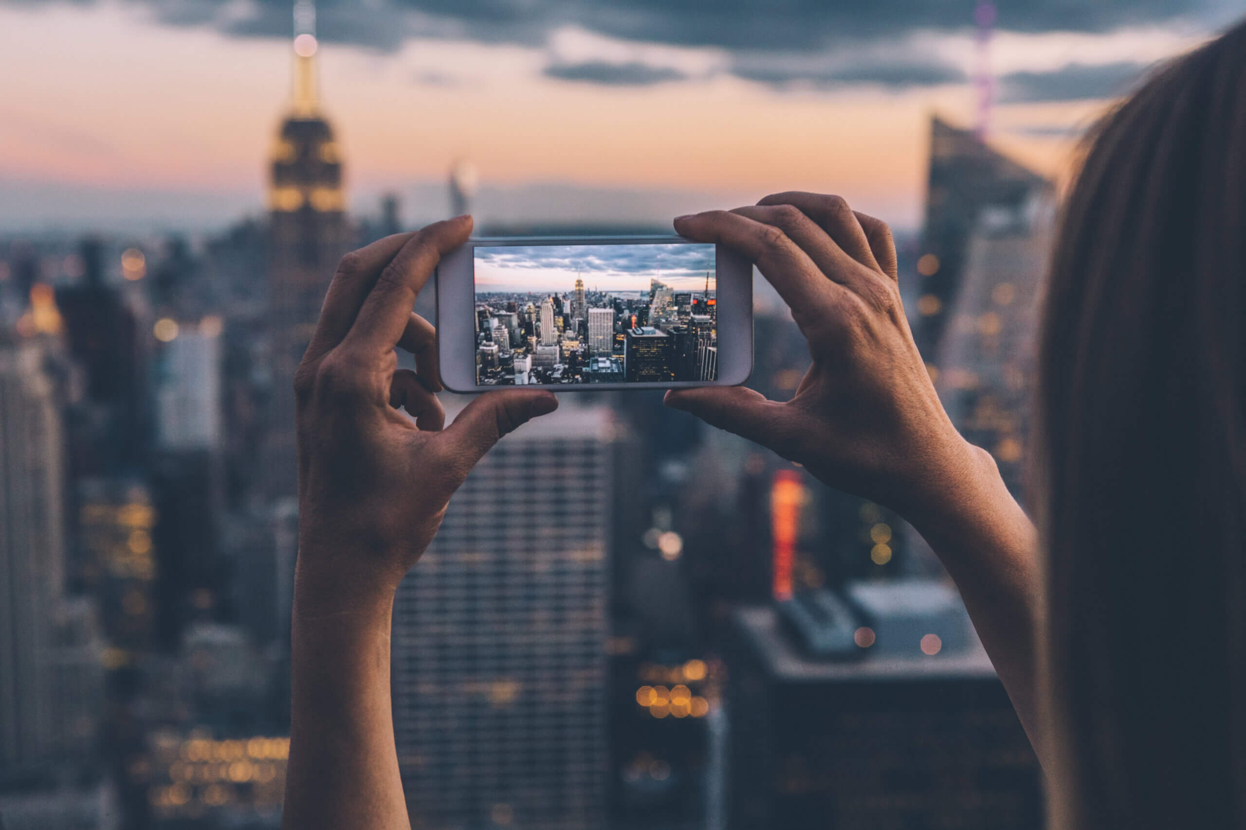 Woman taking a photo of NYC